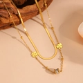 Close-up of gold double-layer necklace with clover charms and polished snake chain detail - C811 Gold Necklace