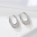 Macro shot of silver U-shaped earrings with a polished mirror finish on stone - 1174 Silver (U-Shape Smooth)