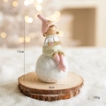Christmas resin angel girl figurine with pink hat sitting on snowball on wood base - Pink Girl/Bear