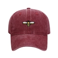 Close-up of a burgundy washed cotton baseball cap featuring detailed bee embroidery - Adjustable / Burgundy