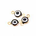 Drie gouden roestvrijstalen evil eye-connectoren met zwart-wit emaille details - Zwart