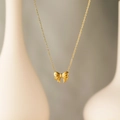 Detail van elegante 18K vergulde ketting met fijne strikhanger en een verfijnde ketting - Gouden Bowknot Ketting (x637 Goud)