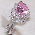 Sparkling silver heart ring with pink gemstone and pavé stones on a white base - US 6 / White Gold