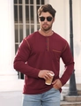 Detail of wine red Henley shirt featuring button collar, chest pocket and knit texture - Burgundy