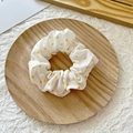 Elastic fabric scrunchie with yellow polka dots on white background in wooden tray - White with Yellow Polka Dots