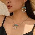 Detail van vintage boheemse zilveren sieradenset met turquoise stenen en hartjesketting - Spiraalvormige Vortex Vorm (5076)