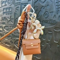 Mini leather bag keychain bag charm with balloon dog pendant and braided rope strap. - Coffee