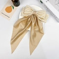 Elegant beige plaid and satin bow hair clip with long streamers on a cream background - Small Champagne Gingham