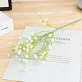 Single white artificial baby's breath flower stem with dense petals on wooden table - Short Stem-White