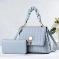 Detail of light blue quilted bucket bag and wallet set with gold hardware and tassel decor - Large Bag and Wallet Set / Light Blue