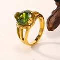 Detailed close-up of 18K gold-plated snake ring featuring a large green faceted zircon stone - Gold Olive Green Zirconia