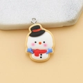 Detail of a cute resin snowman charm with a black hat and red scarf for DIY jewelry - Snowman with Pin