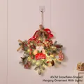 45CM snowflake Christmas wreath with Santa, LED lights, and berries on white wall - 45cm Snowflake Hanging with LED