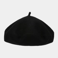 Close-up of classic black wool beret showing soft felt texture and vintage round shape - Black