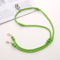 Close-up of green beaded crossbody chain with golden lobster clasps on white background - Acrylic Beaded (K1282) / Green