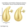 Detailed view of gold stainless steel teardrop earrings with dimensions 31mm by 18mm - Hollow Waterdrop Earrings / Gold