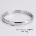 Macro shot of polished 8mm silver bangle with dimensions 63x54mm and weight 31g - Men's Steel Color