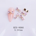 Macro view of pink heart rhinestone bow nail charms with 9.5x4mm dimension detail - Pink Gold Base Bow (8066)