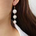 Elegant gold drop earrings featuring three graduated faux pearls in a vertical tassel style - Short Style (3 Pearls)