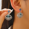 Close-up of fan-shaped Evil Eye earrings featuring blue rhinestones and delicate crystal inlay - 09 White K Style (8362)