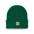 Close-up of dark green knitted beanie featuring a beige embroidered smiley face patch - Grass Green