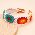 Bohemian crochet flower headband featuring colorful daisy patterns on white knit fabric - Orange Floral