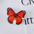 Miroir de maquillage pliant en forme de papillon orange sur fond blanc épuré - Motif Orange Noir Blanc