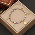 Stainless steel beaded bracelet with gold flower pendant and turquoise charms on a box - Green Bead Gold Flower Style (2#)