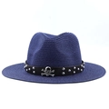 Detail of dark blue woven fedora featuring black leather band with silver skull emblem - Navy Blue