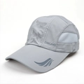 Detail of dark grey breathable mesh panels and laser-cut holes on the dry-fit sports cap - Adjustable / Light Gray