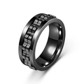 Macro view of black titanium steel spinner ring with gear-like anxiety relief texture - Size 6 / Black
