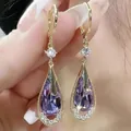 Elegant gold drop earrings with pear-shaped purple gemstone and white zircon accents - Purple Crystal Drop Earrings
