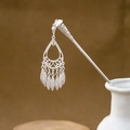 Detail of silver geometric hair stick with hollowed water drop charms and leaf tassels - Teardrop Hollow Multi-Tassel (F366)