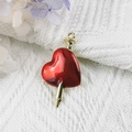 Red heart enamel pendant with gold nail through center on white knit fabric background - 14-Gold Red Heart Pierced