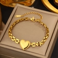 Close-up of gold heart pendant bracelet with textured edges on jewelry display box - Gold Heart Rectangular Chain (FSY727)