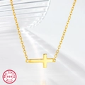 Detailed close-up of a 925 sterling silver gold-plated horizontal cross pendant necklace - Gold