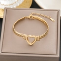 Elegant 18K gold plated stainless steel woven chain bracelet with hollow heart charm - Gold Braided Chain Hollow Heart Style (5266)