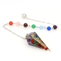 Close-up of a resin chakra pendulum featuring natural crystal chips and golden symbols - Chakra Symbols + Seven Chakra Beads Chain