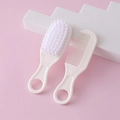 Beige baby hair brush and comb set for newborns with soft bristles on pink background - White Comb and Brush Set