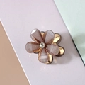 Detailed macro view of the 3D resin flower hair clip with sparkling petals and rhinestone center - Crystal Glitter Style / Gray