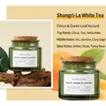 Scented soy wax candle in green glass jar with cork lid and Shangri-La White Tea fragrance - Shangri-La White Tea