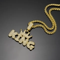 Macro shot of hip-hop KING pendant with crown and pave-set crystals on gold rope chain - 60cm Spiga Chain / Gold