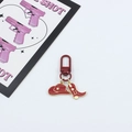 Detail of red cowboy hat and boot keychain with gold star patterns and D-ring buckle - 9 Red - Matching Clasp