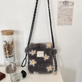 Detail of grey plush crossbody bag with daisy embroidery and a black and white cord strap - Gray Sunflower