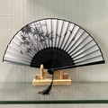 Classic folding fan with black bamboo and dragonfly ink painting and tassel charm - Lush Pine and Bamboo