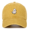 Detail of white ghost embroidery on mustard yellow washed cotton baseball cap texture - Yellow