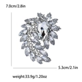 Silver flower brooch with clear crystals and dimensions 7.0cm by 5.3cm shown in detail - Silver