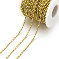 Golden stainless steel chain with alternating white pearls and yellow rhinestones on a spool - 2mm Lemon Yellow