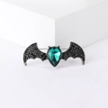 Gothic bat brooch with large green teardrop gemstone and black rhinestones on dark alloy - Black With Green Gemstone
