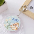 Portable round folding mirror keychain with blooming season dog motif and PU finish - Burger Husky